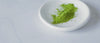 green matcha powder on coutertop plate