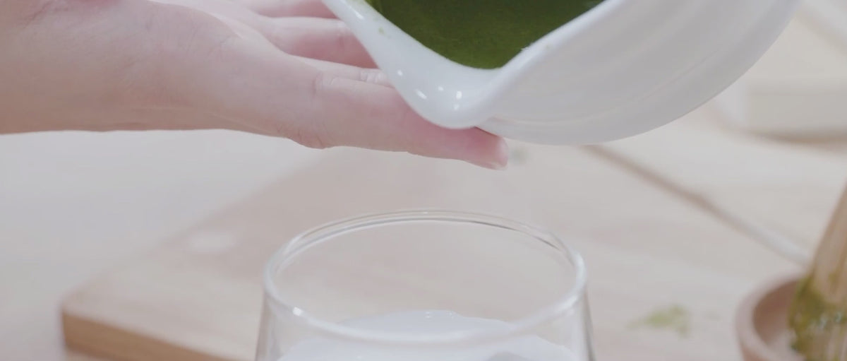 pouring matcha into glass